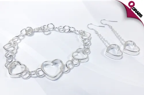 From QR35, Show Your Love with a Heart Jewelry Set - Includes Earrings and a Bracelet in Silver Finish! (Up to QR138 Value)